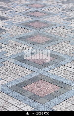 Sidewalk for pedestrians from gray paving stone, perspective view. Stock Photo