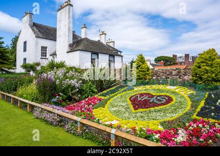 Floral display thanking the NHS during the Covid-19 pandemic in The Lodge Gardens with The Lodge in the background in North Berwick, East Lothian, UK Stock Photo