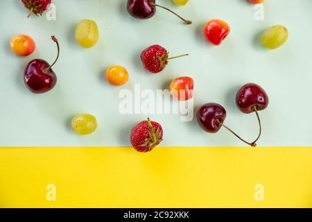 Various berries isolated on colorful background, top view. Berry border frame. Flat lay.fresh berries pattern.Summer vitamin food concept, various Stock Photo