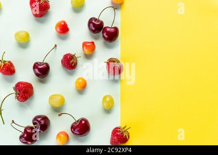 Various berries isolated on colorful background, top view. Berry border frame. Flat lay.fresh berries pattern.Summer vitamin food concept, various Stock Photo