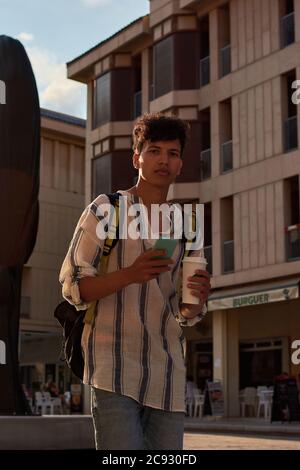 Afro-haired man looks seriously into the camera Stock Photo