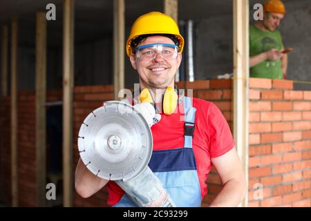 Man holding construction tool Stock Photo