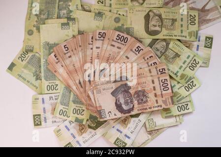 Overhead shot of 500 and 200 peso banknotes in a pile Stock Photo