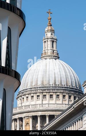 Detail of dome, with window reveals of 30 Cannon Street (former Credit Lyonnais building) on the left of frame. St. Paul's Cathedral, London, United K Stock Photo