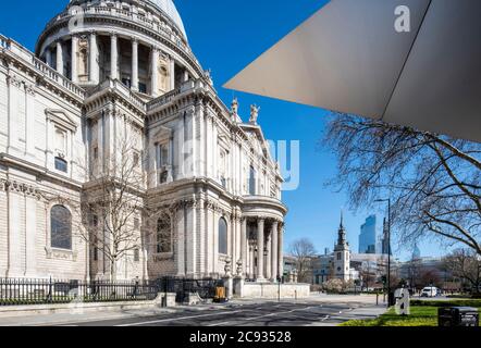 Oblique view looking east along St. Paul's Churchyard with overhang of Make Architects' Information Pavilion, spire of St. Augustine's and the Eastern Stock Photo