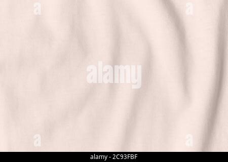 Texture and background of crumpled beige fabric. Stock Photo