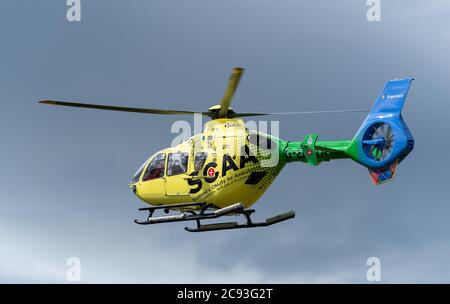 26 July 2020. Alvah Bridge, Banff, Aberdeenshire, Scotland, UK. This is one of the SCAA, Scottish Charity Air Ambulance departing from the Bridge of A Stock Photo