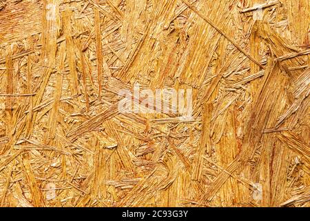 pressed wooden panel background, seamless texture of oriented strand board - OSB wood Stock Photo