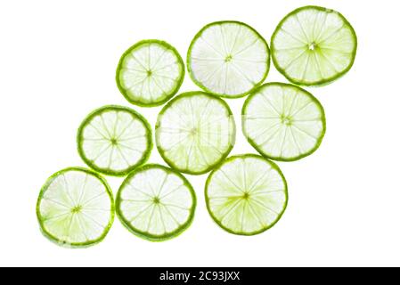 Green lime slices isolated on white background. Stock Photo