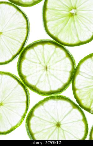 Green lime slices isolated on white background. Stock Photo