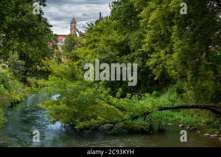 Vilnia River along Uzupis an alternative neighbourhood in the old town of Vilnius, Lithuania. Stock Photo