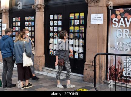 London, UK, 28 July 2020 Concert goer read attendance instructions. Government monitored trial of live indoor event as Frank Turner plays the Grand at Clapham Junction, Battersea. 180 fans with staggered arrival times and temperature monitoring will attend. Credit: JOHNNY ARMSTEAD/Alamy Live News Stock Photo
