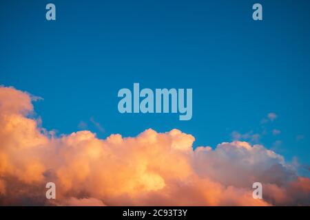 blue sky with orange clouds before sunset, cloudy skyscape background photo Stock Photo