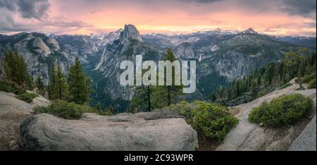 half dome and waterfalls from glacier point in yosemite national park at sunset, usa