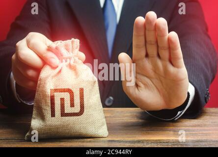 Businessman refuses to give Israeli shekel money bag. Asset freeze. Stop financing projects and reforms, crisis financial difficulties. Loan refusal, Stock Photo