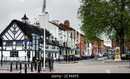 Stone, Staffordshire / United Kingdom - May 19 2019: Crown and Anchor pub in Stone. White old building and the road near it. Stock Photo