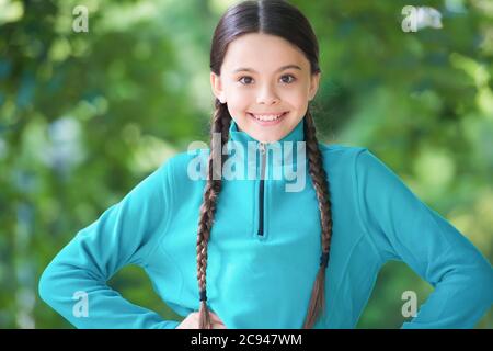Girl wear fleece jumper for active leisure nature background, summer vacation concept. Stock Photo