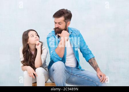 Love makes you family. Little girl and bearded man look at each other. Loving relationship between father and small daughter. Feeling of love and security. Trust and care. Family relationship. Stock Photo