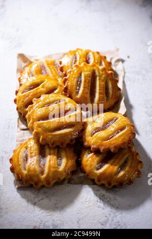 Fruit cookies.Pastries stuffed with apples.Sweet dessert.Healthy food and drink. Stock Photo