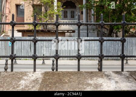 Historical protection fence from cast iron material squarely positioned. Stock Photo