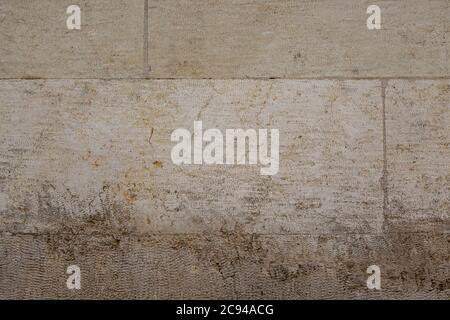 Gray colored lime stone wall texture. Brushed blocks with flat cuts. Stock Photo