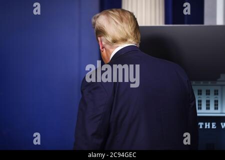 President Donald Trump walks out of the podium after a press briefing in the Brady Press Briefing Room of the White House on July 28, 2020 in Washington, DC.Credit: Oliver Contreras/Pool via CNP /MediaPunch Stock Photo