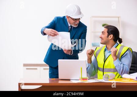 Two architects working in the office Stock Photo