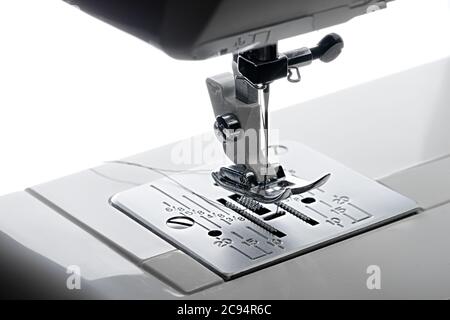1 - Elevated close up view looking from the left hand side of the working area of a sewing machine. Stock Photo