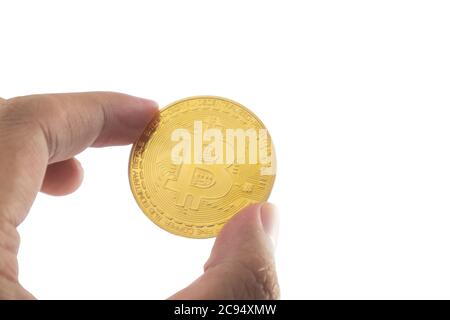 Bitcoin holding in hand isolated on white background with clipping path. Stock Photo