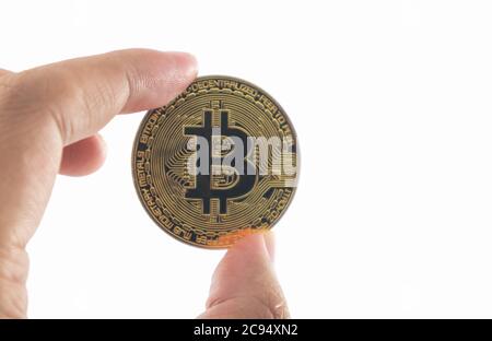 Bitcoin holding in hand isolated on white background with clipping path. Stock Photo