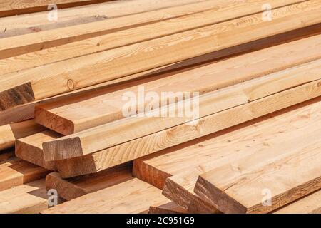 Stack of fresh construction boards or bars Stock Photo
