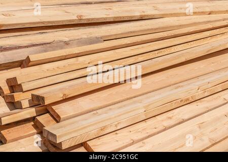 Stack of fresh construction boards or bars Stock Photo