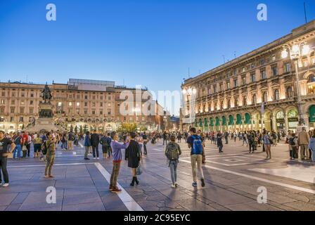 MILAN, ITALY - SEPTEMBER 2015: Tourists and locals enjoy night life in Duomo Square, city tourist center Stock Photo