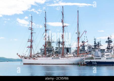 Sedov - four-masted steel barque in port Vladivostok. STS Sedov moored in the bay Golden Horn Stock Photo