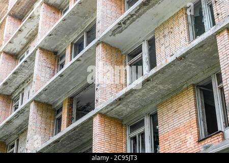 Facade of an old abandoned apartment building Stock Photo