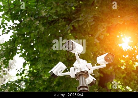 video surveillance system on a pole in the park close-up Stock Photo
