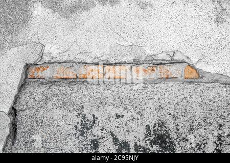 Corner background element of destroyed wall with cracks and scratches Stock Photo