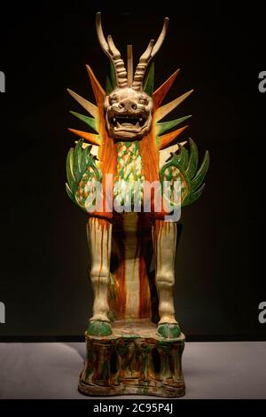 Tokyo, Japan - April 17, 2020 : ancient three-color sancai glaze pottery mythical beast tomb guardian statue figure in Tang dynasty, 7th - 8th century Stock Photo