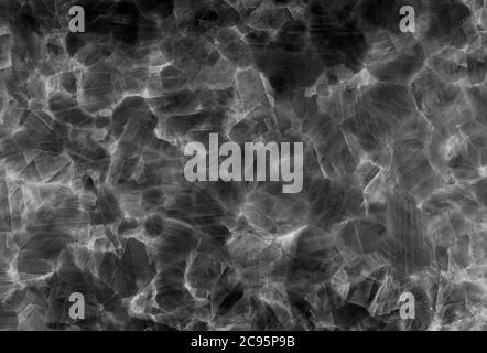 detail of black and white translucent slice of natural quartz agate marble stone. natural patterns and textures of minerals for background. Stock Photo