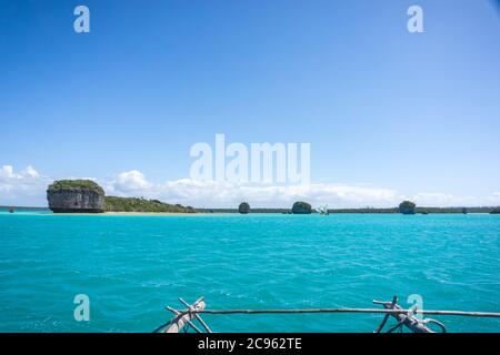 Boat trip on a traditional caledonian sailing boat in Upi bay. typical rocks in the turquoise sea. seascape of Pines Island, new caledonia: turquoise Stock Photo