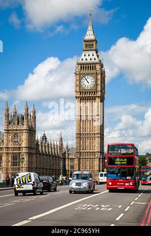 London, Great Britain - Big Ben. Street scene with red double-decker bus and taxi at Westminster Bridge with a view of the Houses of Parliament with t Stock Photo