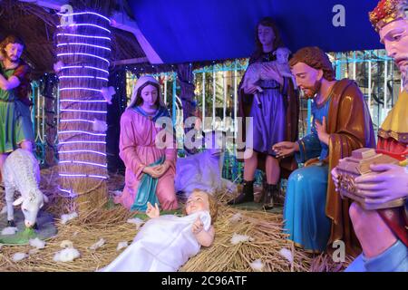 Kolkata, West Bengal/India - December 29, 2019: A model of the Nativity scene at Jesus birth in a stable in Bethlehem. Dummy human model statue with s Stock Photo