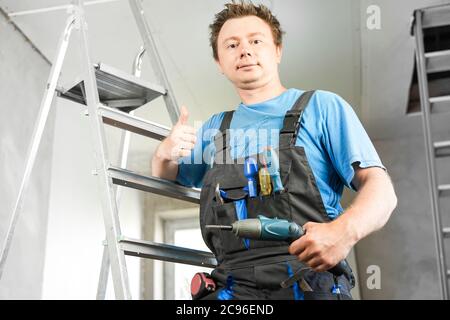 Guy in work clothes shows like Stock Photo
