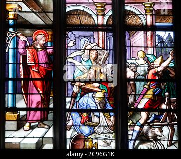 Sainte Croix (Holy Cross) church, Bernay, Eure, France. Stained glass. Jesus driving the merchants from the Temple. Stock Photo