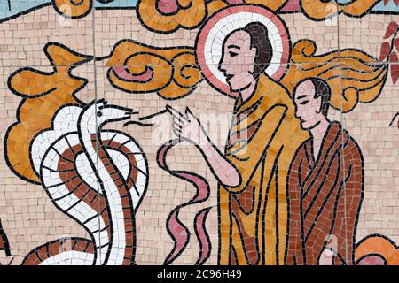 Ong Nui buddhist pagoda. Wall fresco.  The life of the Buddha.  Shakyamuni Buddha with the snake. Quy Nhon. Vietnam. Stock Photo
