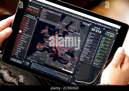 Coronavirus (COVID-19)  epidemic. Man reading news on Ipad. Close up. France. Stock Photo
