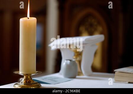 Church candel on altar.  Annecy. France. Stock Photo