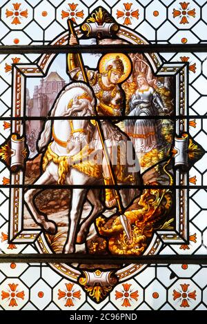 St George's church, Saint-Georges-du-Vivre, Eure, France. Stained glass depicting the life of Saint George. Stock Photo