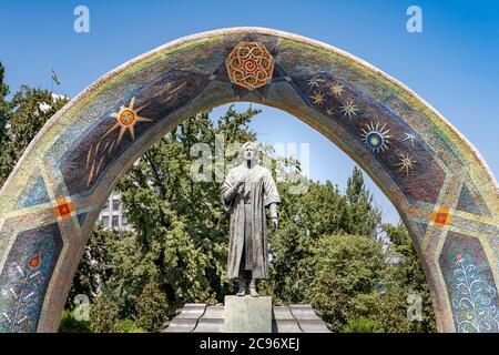 The arched Monument to Rudaki in Rudaki Park in Dushanbe Stock Photo