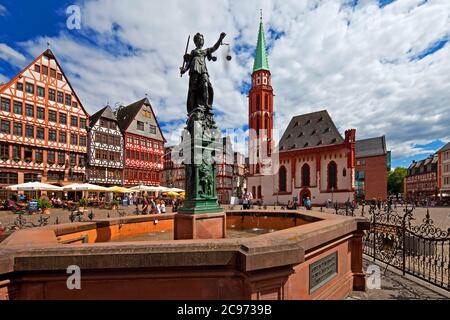 fountain of justice on the Roemerberg in the old city, Old St Nicholas Church in background, Germany, Hesse, Frankfurt am Main Stock Photo